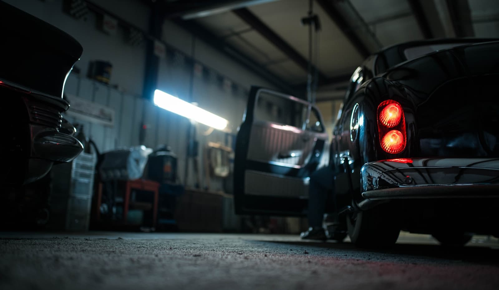 The Canvas studio interior, controlled low light, finished vehicles inside.